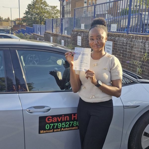 A learner celebrating passing their driving test with UDrive2Day in Bury St Edmunds